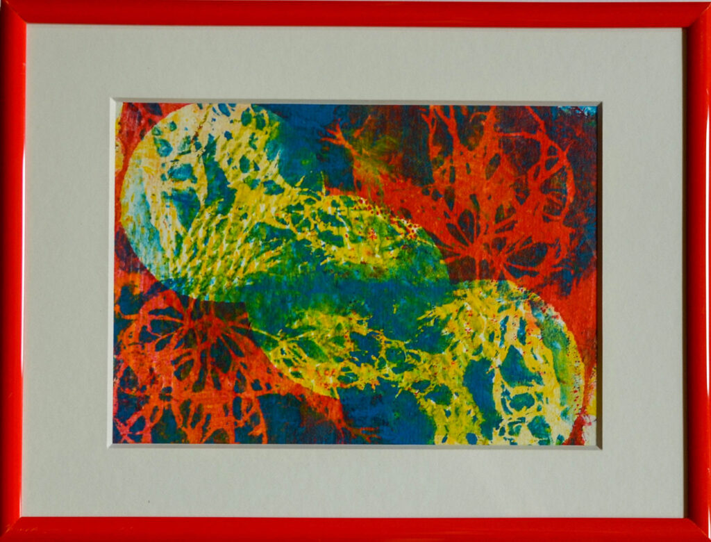 Bild mit Drucktechnik auf Gelatineplatte in blau rot gelb grün in orangem Rahmen